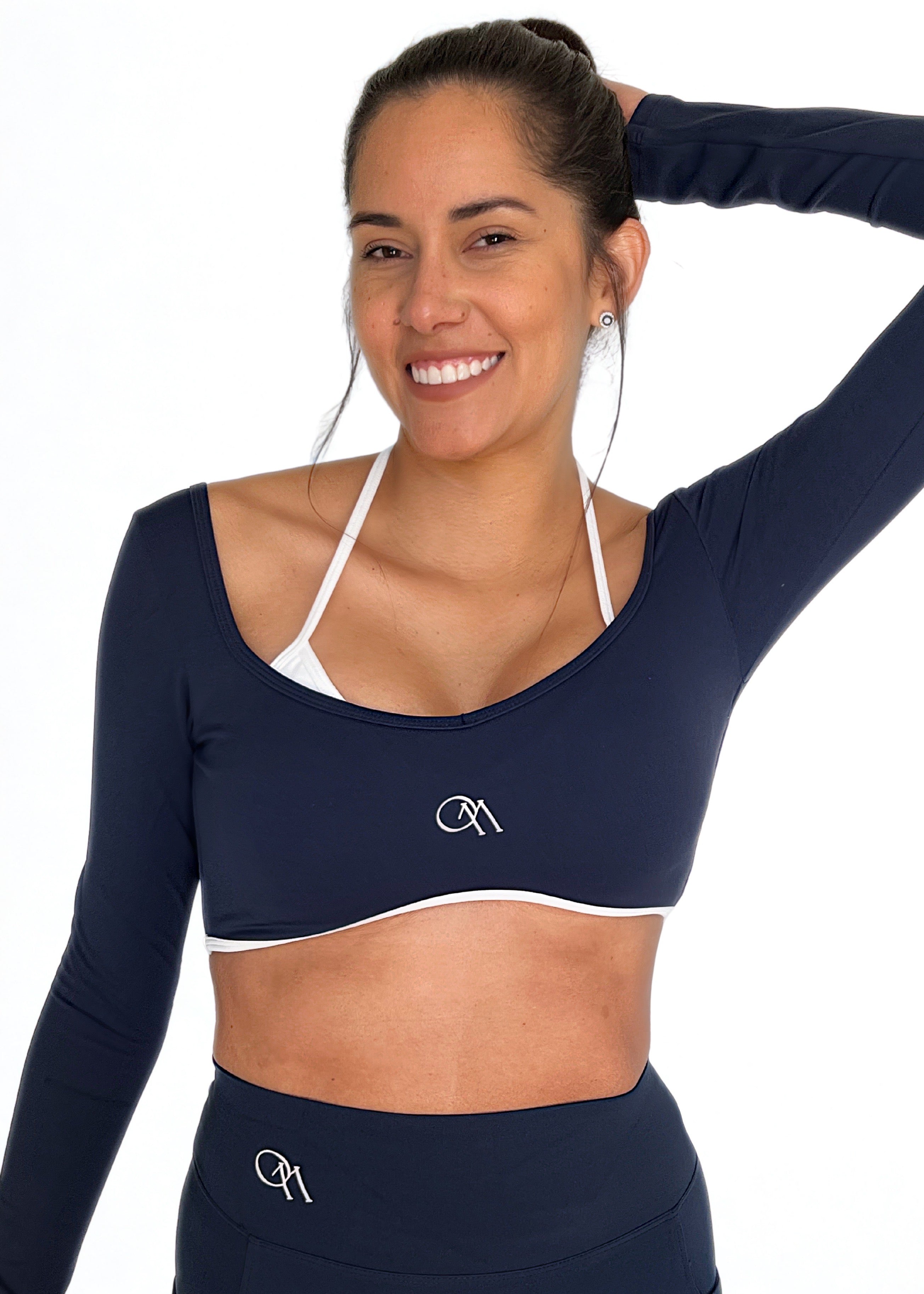 top deportivo azul marino para mujer con soporte medio, ideal para gimnasio