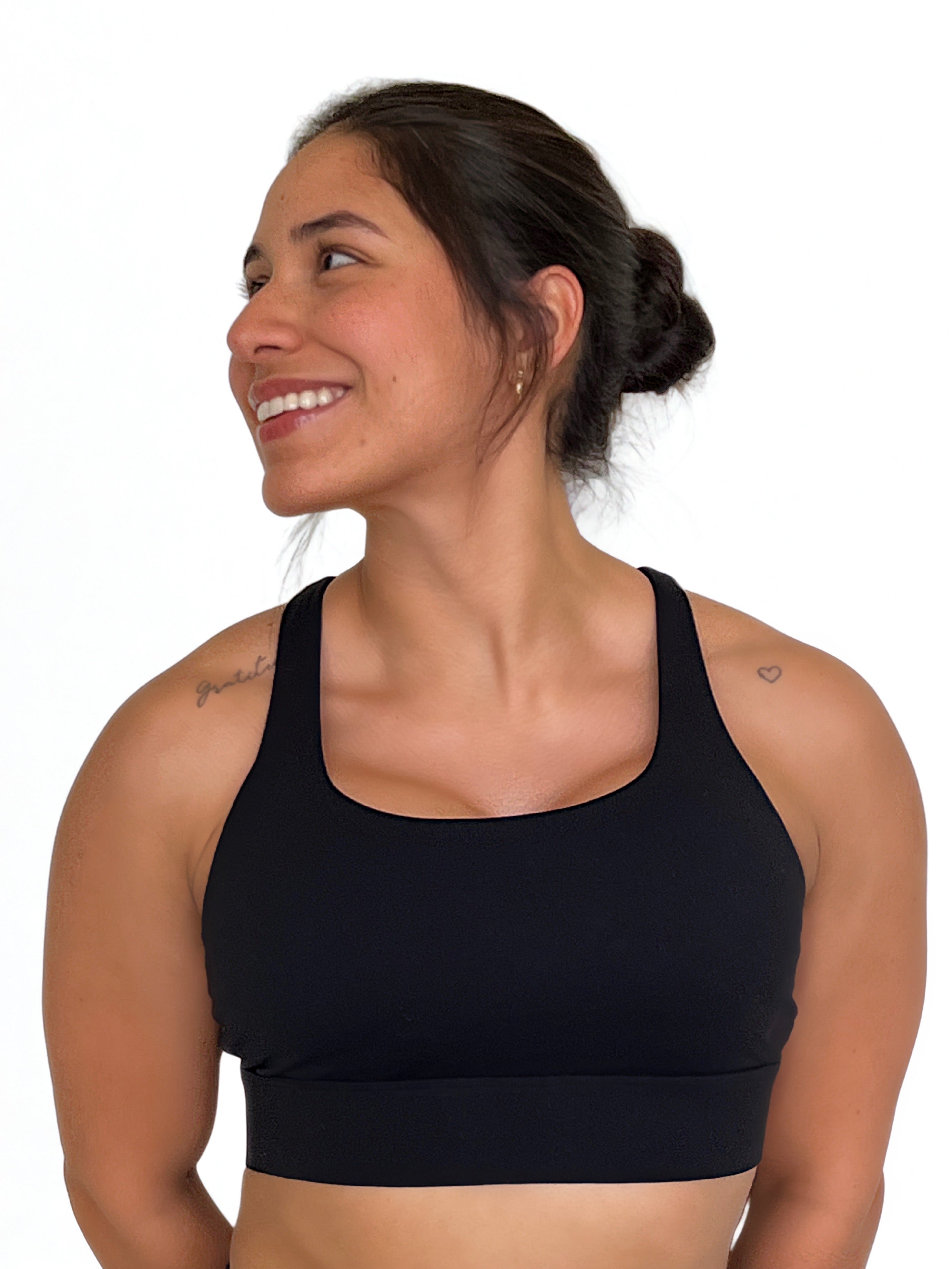 top deportivo negro para mujer con soporte alto, ideal para entrenamiento intenso y crossfit