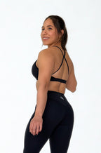Calza deportiva negra para mujer con control de abdomen, ideal para entrenamiento